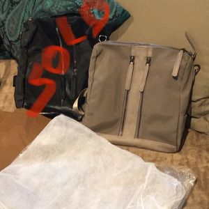 Elegant waterproof zippered back pack w/dust cover